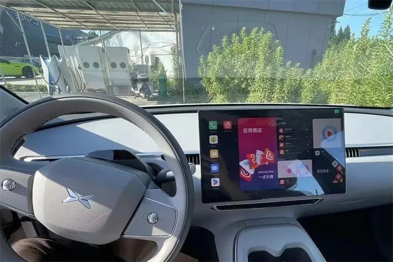 XPENG MONA M03 interior spy photos are here, focusing on simplicity, similar to the Tesla Model 3